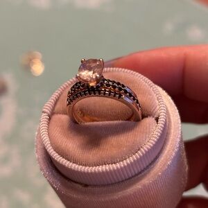 Three band rose gold with black Onyx and coral as main stone. Gorgeous ring